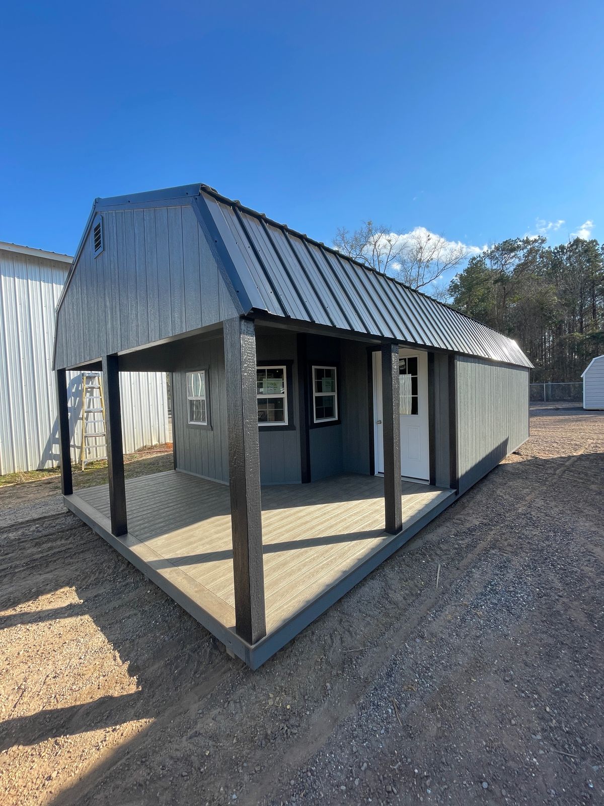 Lofted barn cabin with porch at our Sneads lot